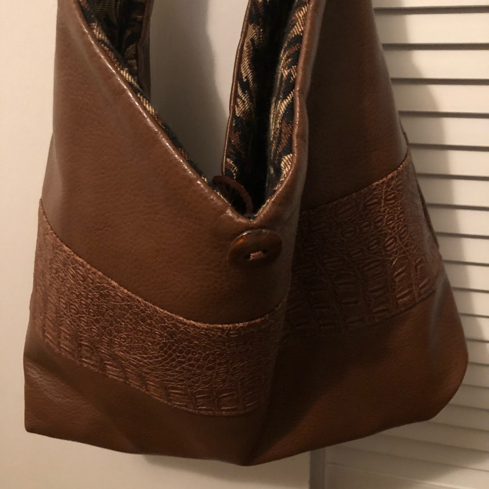 Reversible vegan leather and cheetah bag